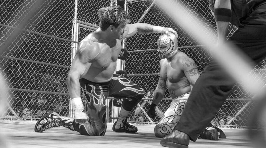 Rey Mysterio and Eddie Guerrero in a steel cage match